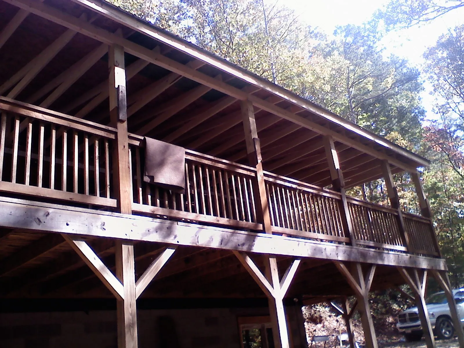Timber framing under a new elevated porch and deck — Roof Leak Repair in Denver by Roofing Brothers